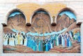 Mosaic representing Jesus Christ at the entrance of a small Coptic church with a wooden column porch