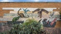 Mosaic stone mural on the front of the Herpetarium as the Dallas Zoo.