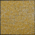 mosaic tile background _A yellow tiles mosaic texture with a random pattern and a ceramic element Royalty Free Stock Photo