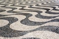 Mosaic Tiles Pavement Pattern on Streets and Squares in Lisbon, Portugal Royalty Free Stock Photo