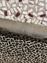Mosaic tiles on the wall of the house. Architectural abstract background texture. Gray concrete. Royalty Free Stock Photo