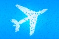 Mosaic, white plane on a blue background, stained glass, silhouette of an airplane