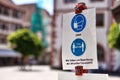 Mosbach, Germany - Signs for face mask and distance requirement in German city with text saying Royalty Free Stock Photo