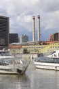 Moscow, April 3, 2021, the beginning of navigation on the Moscow River, motor ships on an industrial background