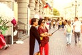 Two adult asian women taking a selfie using smartphone