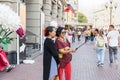 Two adult asian women taking a selfie using smartphone