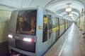 MOSCOW, AUG, 22, 2017: Modern cube style subway passenger grey train at metro station. Perspective front view of train cabin. Russ