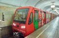 MOSCOW, AUG, 22, 2017: Modern subway passenger red train at metro station. Perspective front view of train cabin. Metro train with