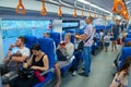 MOSCOW, AUG.29, 2018: View on seating, standing and walking people in the passenger train saloon on Moscow Ring Railway line. City