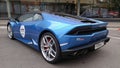Moscow. Autumn 2018. Bright blue Lamborghini Huracan parked on the street. Backlights and grill. Side view