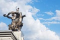 Back view of Worker and Kolkhoz Woman sculpture. Man and woman made of steel with sickle and hammer raised over