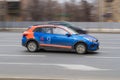 Moscow carsharing Belka Car. Kia Rio hatchback rushes along the street on high speed