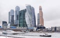 Moscow city on the banks of the Moscow river, boat on the river, winter, buildings