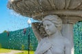 Fountain marble Statue of a woman and a fountain, water pours. drops of water and face