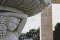 Fountain marble Statue of a woman and a fountain, water pours. drops of water and face