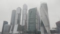 Moscow City skyscrapers in a foggy weather. Action. Amazing and unusual high rise buildings, business life of the