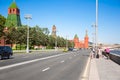 Moscow cityscape around Kremlin Embankment, with Kremlin to the left, people go sightseeing, Russia.