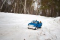 Moscow. December 2018. Blue toy Pickup truck Ford F350 with open door in snow forest in the road. Carrying fir cones Royalty Free Stock Photo