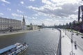 Moscow downtown scene with moskva river and a touristic boat sailing