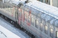 MOSCOW, FEB. 01, 2018: Winter view on railway passenger coaches cars at rail way depot covered by ice and snow. Russian railways p