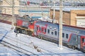 MOSCOW, FEB. 01, 2018: Winter view on Russian railway diesel locomotive pulling passenger coaches at rail way depot under snow. Sn