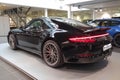 Moscow. February 2019. Black Porsche 911 Carrera 4S 991 in showroom of dealership