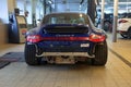 Moscow. February 2019. Blue Porsche 911 in service center. Without rear bumper. Repairing