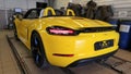 Moscow. February 2019. New yellow Porsche Boxster 718 in service station. Presale preparation and verification Royalty Free Stock Photo