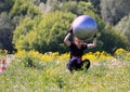 Moscow festival of fitness. A woman jumping with a ball.