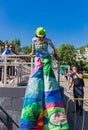 Moscow, Izmailovsky Park, may 27, 2018. A young woman animator on stilts