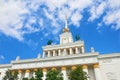 View on VDNKh central padiglione. USSR Empire style white building with traditional soviet golden elements,