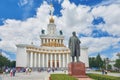 View on VDNKh central pavilion, Lenin monument. USSR Stalinist empire style white building with traditional Royalty Free Stock Photo