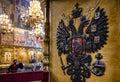 Eagle as coat of arms of Russian Empire on royal throne inside the Dormition Assumption Cathedral in Moscow Kremlin, Russia