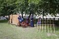 Reconstructors in the image of old Russian musketeers from 16th century. Sunny summer view. Royalty Free Stock Photo