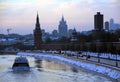 Moscow Kremlin architecture in winter. Cruise ship sails on the river Royalty Free Stock Photo