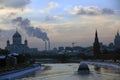 Moscow Kremlin architecture in winter. Cruise ship sails on the river Royalty Free Stock Photo