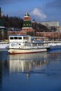 Moscow Kremlin architecture in winter. Cruise ship sails on the river Royalty Free Stock Photo