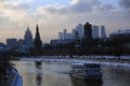 Moscow Kremlin architecture in winter. Cruise ship sails on the Moscow river. Royalty Free Stock Photo