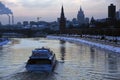 Moscow Kremlin architecture in winter. Cruise ship sails on the river Royalty Free Stock Photo