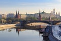 Moscow Kremlin on a Bersenevskaya embankment of Moskva river background in sunny spring morning. View from Patriarshiy bridge Royalty Free Stock Photo