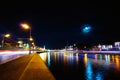 Moscow Kremlin and ships on Moskva river at night under full Moon. Time-lapse Royalty Free Stock Photo