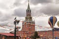 Moscow Kremlin - Spasskaya tower and colored decorations on an overcast winter sky