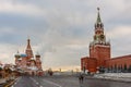 Saint Basil`s Cathedral and Spasskaya tower in Red Square and colorful sky at winter morning