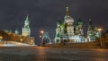 Moscow Kremlin timelapse hyperlapse with Spasskaya tower and Cathedral of St. Basil, Russia. Red Square in winter night Royalty Free Stock Photo