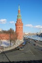 Moscow Kremlin tower and wall. Cars drive along the Moscow river embankment. Royalty Free Stock Photo