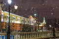 Moscow Kremlin wall and street lamps during snowstorm at night in Russia Royalty Free Stock Photo