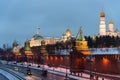 The Moscow Kremlin in the winter night and the Moskva River embankment with a Christmas decoration