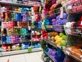 A large assortment in the store of multicolored woolen and cotton threads for knitting and sewing, handicraft and