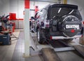 MOSCOW, MAR,02, 2017: Car automobile at wheel alignment maintenance works repair at automotive service center workshop. Technical Royalty Free Stock Photo