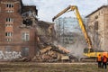 MOSCOW - MARCH 25, 2015: excavator demolishes building 205 schoo